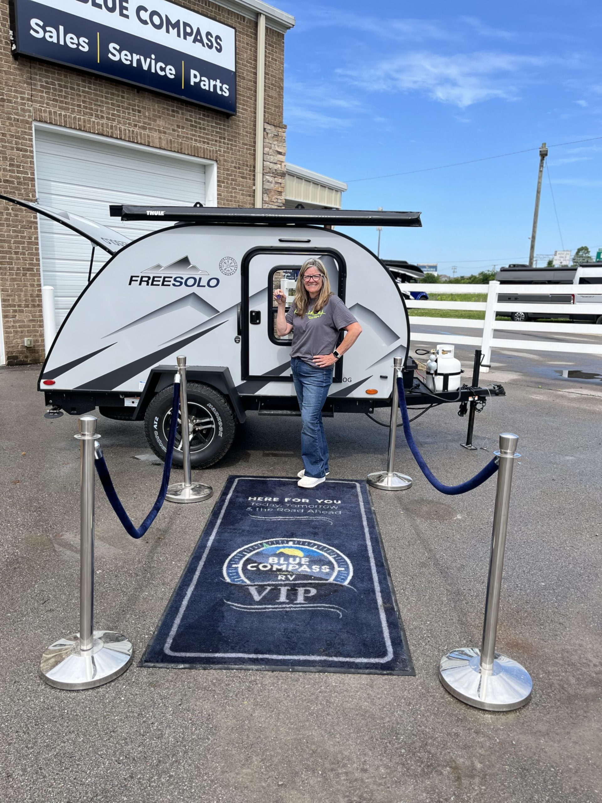 Picture of Kathy Paul with her new FreeSolo camper