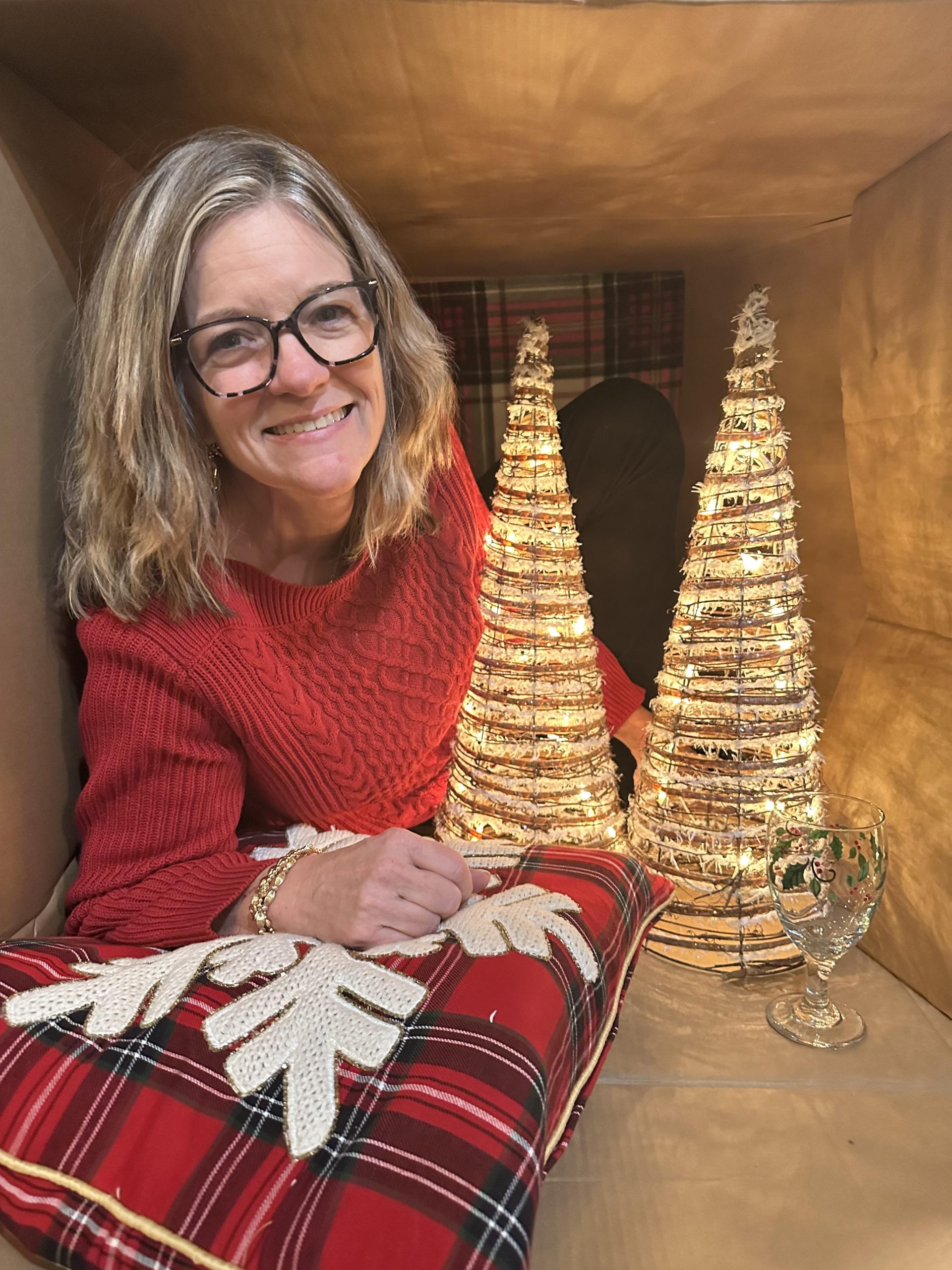 picture of realtor posing with christmas tree